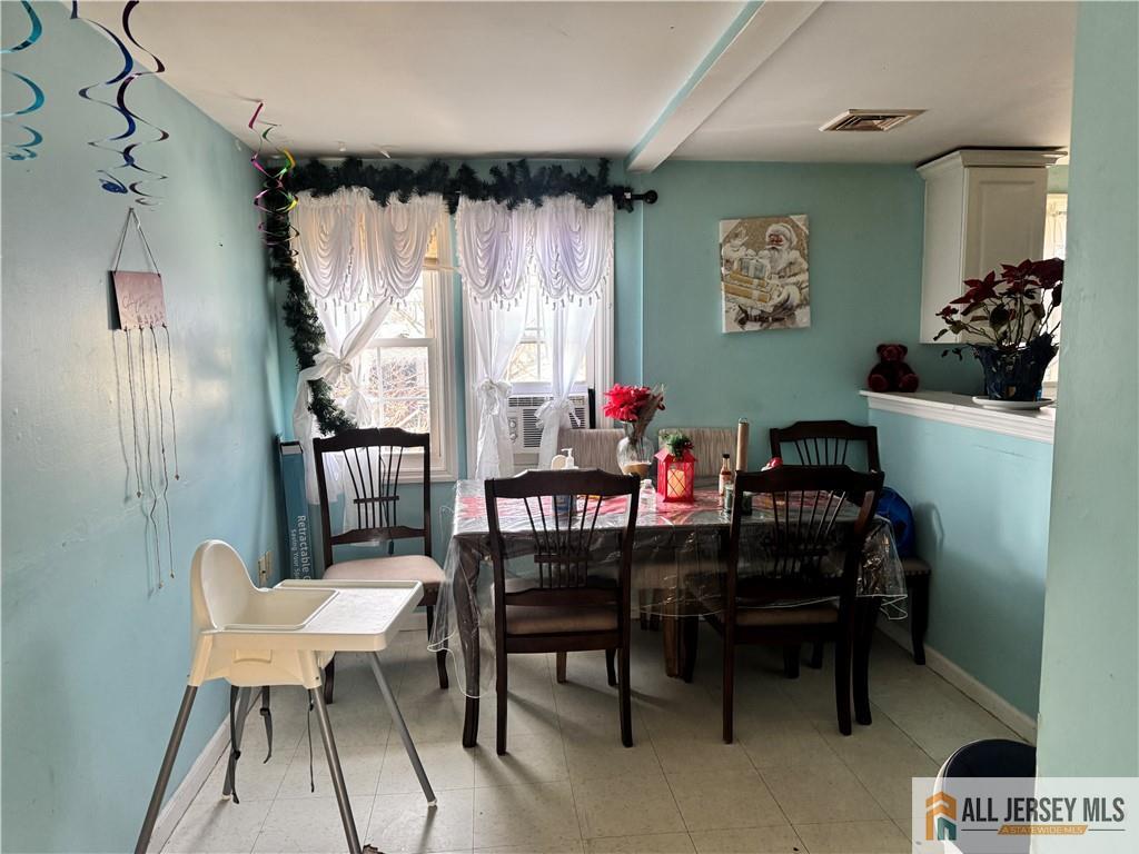 111 Delavan Street New Brunswick, NJ 08901 - Photo 22 of 28 a dining room with furniture and window