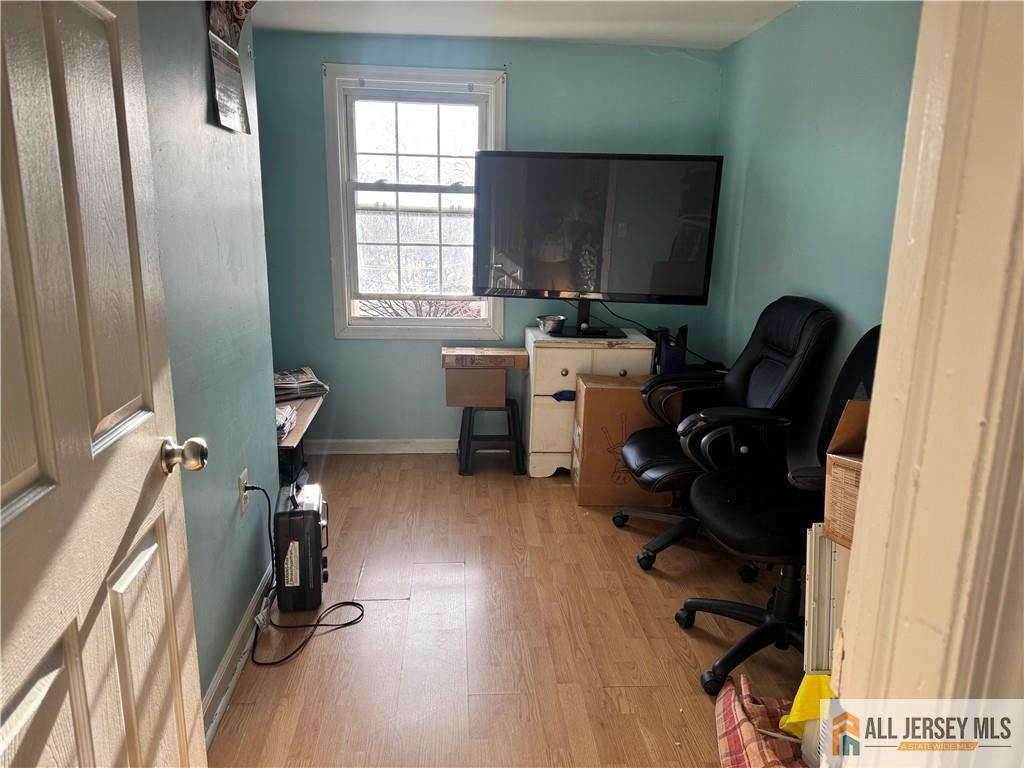 111 Delavan Street New Brunswick, NJ 08901 - Photo 25 of 28 a view of a workspace with furniture and a window