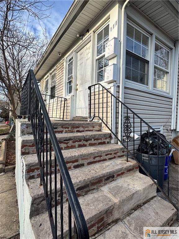 111 Delavan Street New Brunswick, NJ 08901 - Photo 4 of 28 a view of a house with backyard and wooden deck