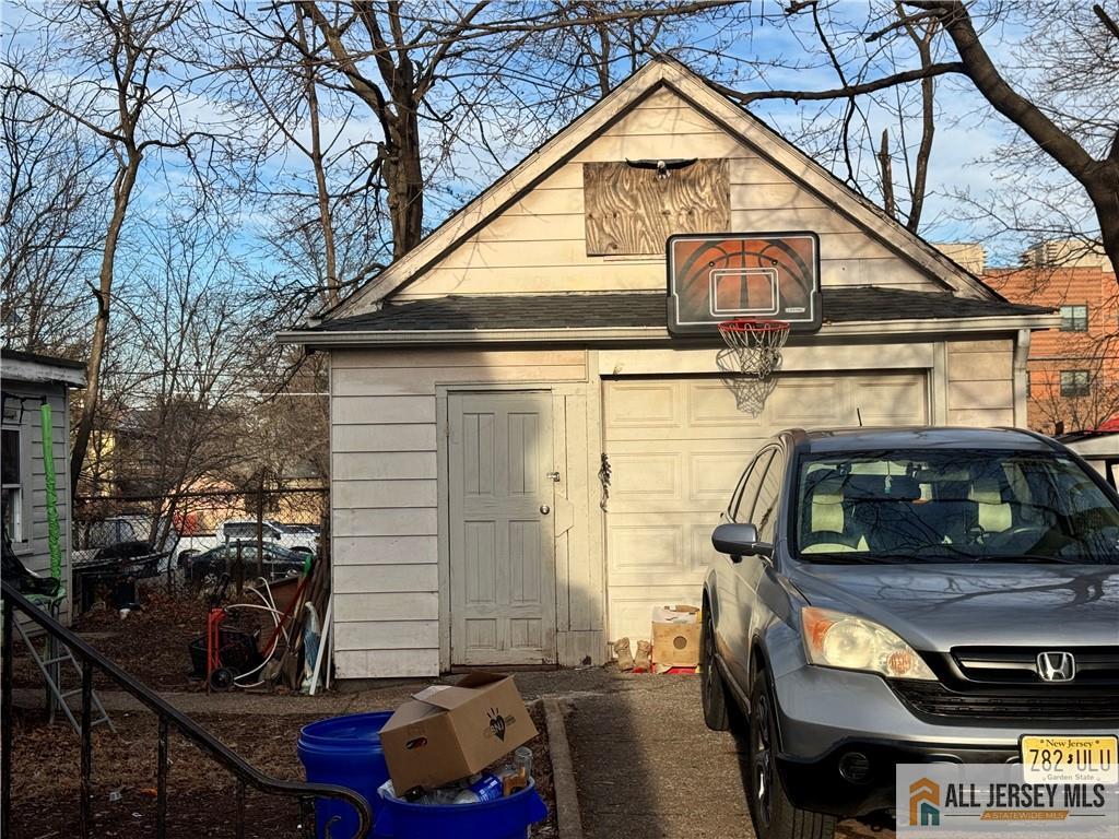 111 Delavan Street New Brunswick, NJ 08901 - Photo 6 of 28 a view of a car park in front of house