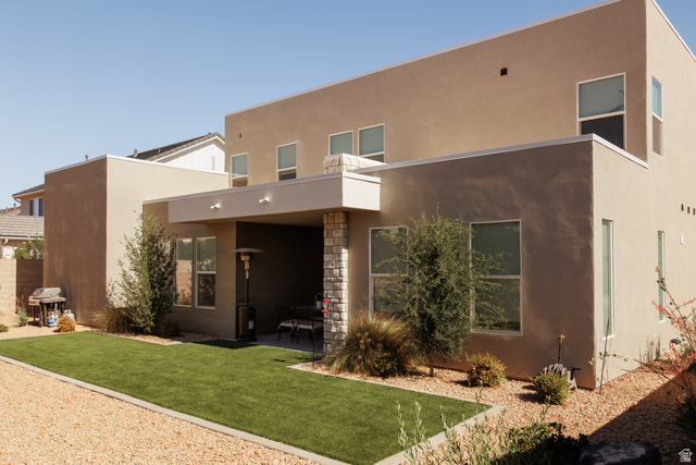629 Spring Lily Drive St. George, UT 84790 - Photo 38 of 50 Contemporary stucco exterior featuring an integrated patio with stone-clad columns