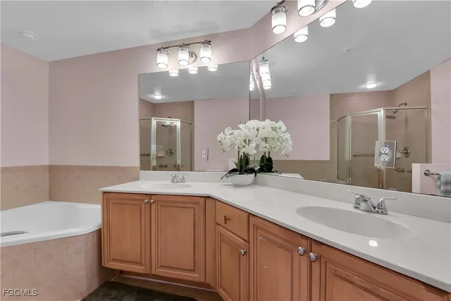 a bathroom with a granite countertop sink a large mirror and a vanity