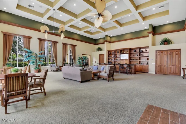 a view of a livingroom with furniture and a garage