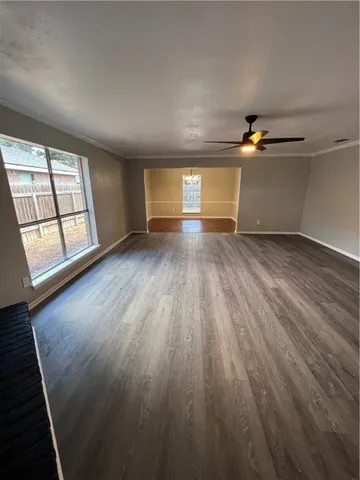 a kitchen with a sink a stove and cabinets