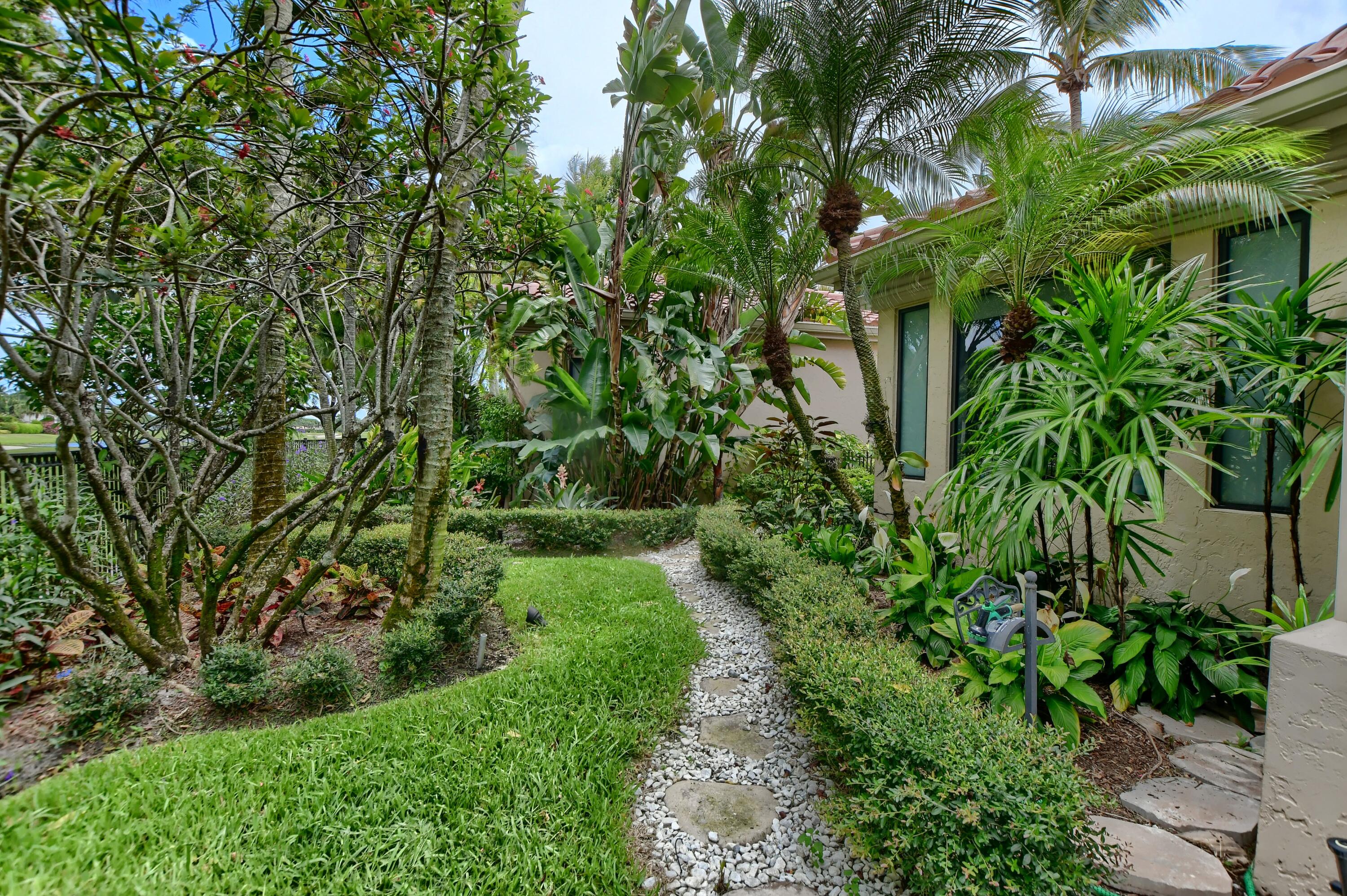 5894 Northwest 25th Court Boca Raton, FL 33496 - Photo 14 of 46 grassy pathway