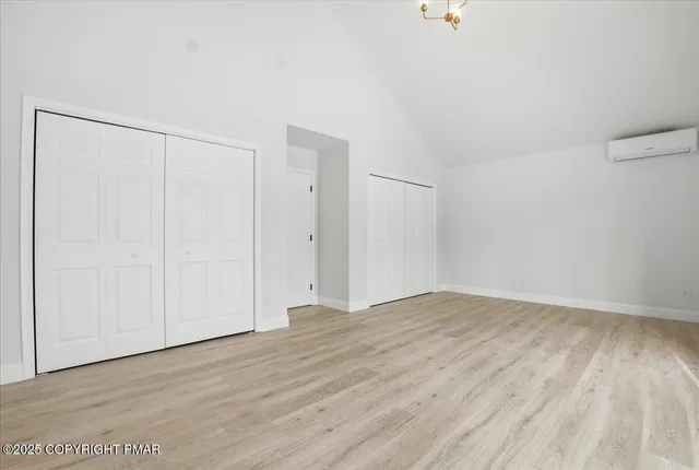 a bathroom with a toilet a sink and a mirror