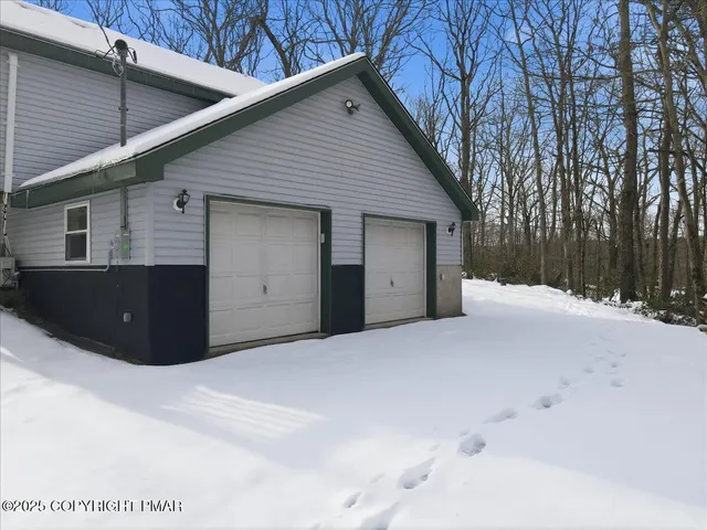 a view of a house with wooden deck