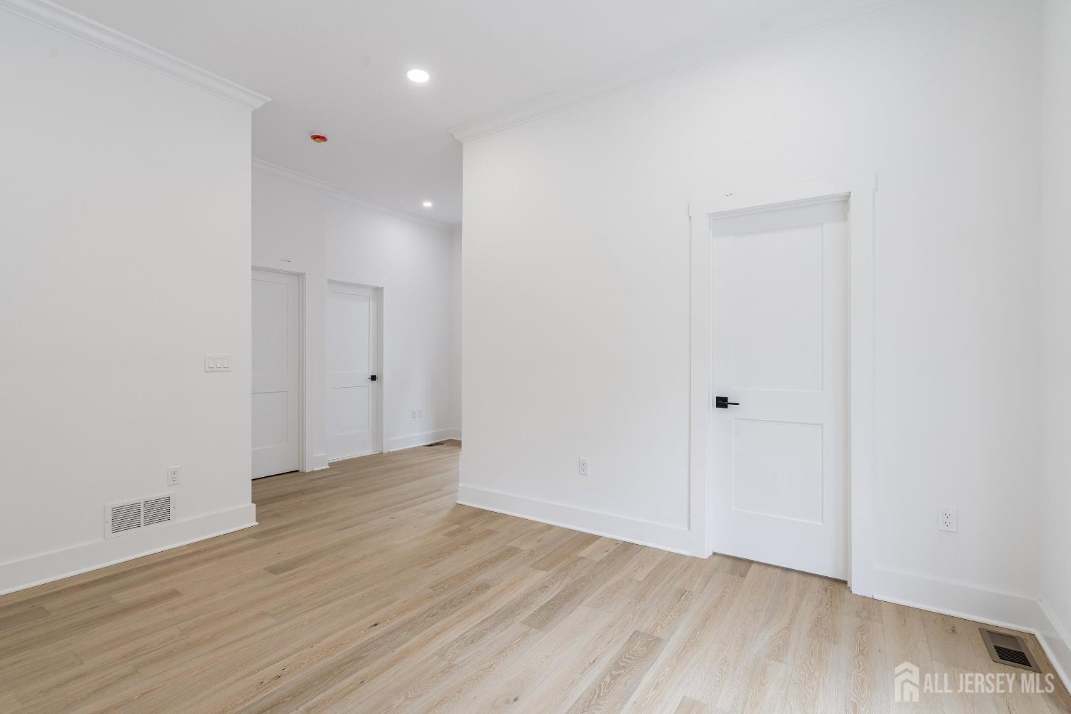 34 Mill Road Manalapan, NJ 07726 - Photo 12 of 30 a view of an empty room with wooden floor