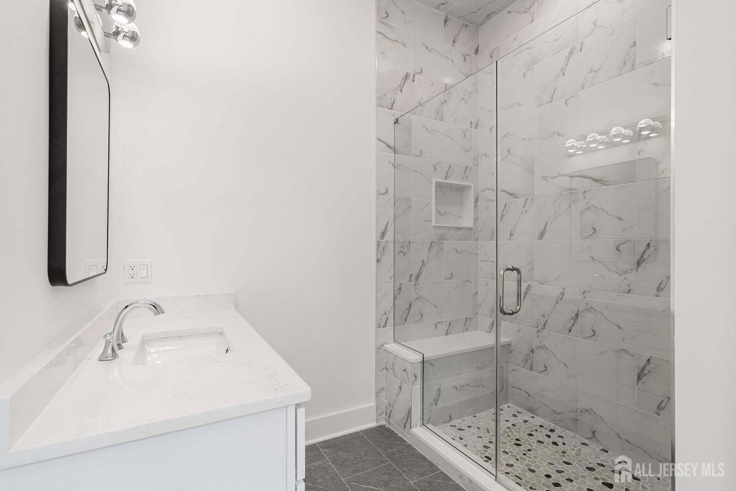 34 Mill Road Manalapan, NJ 07726 - Photo 14 of 30 a bathroom with a sink shower and a mirror