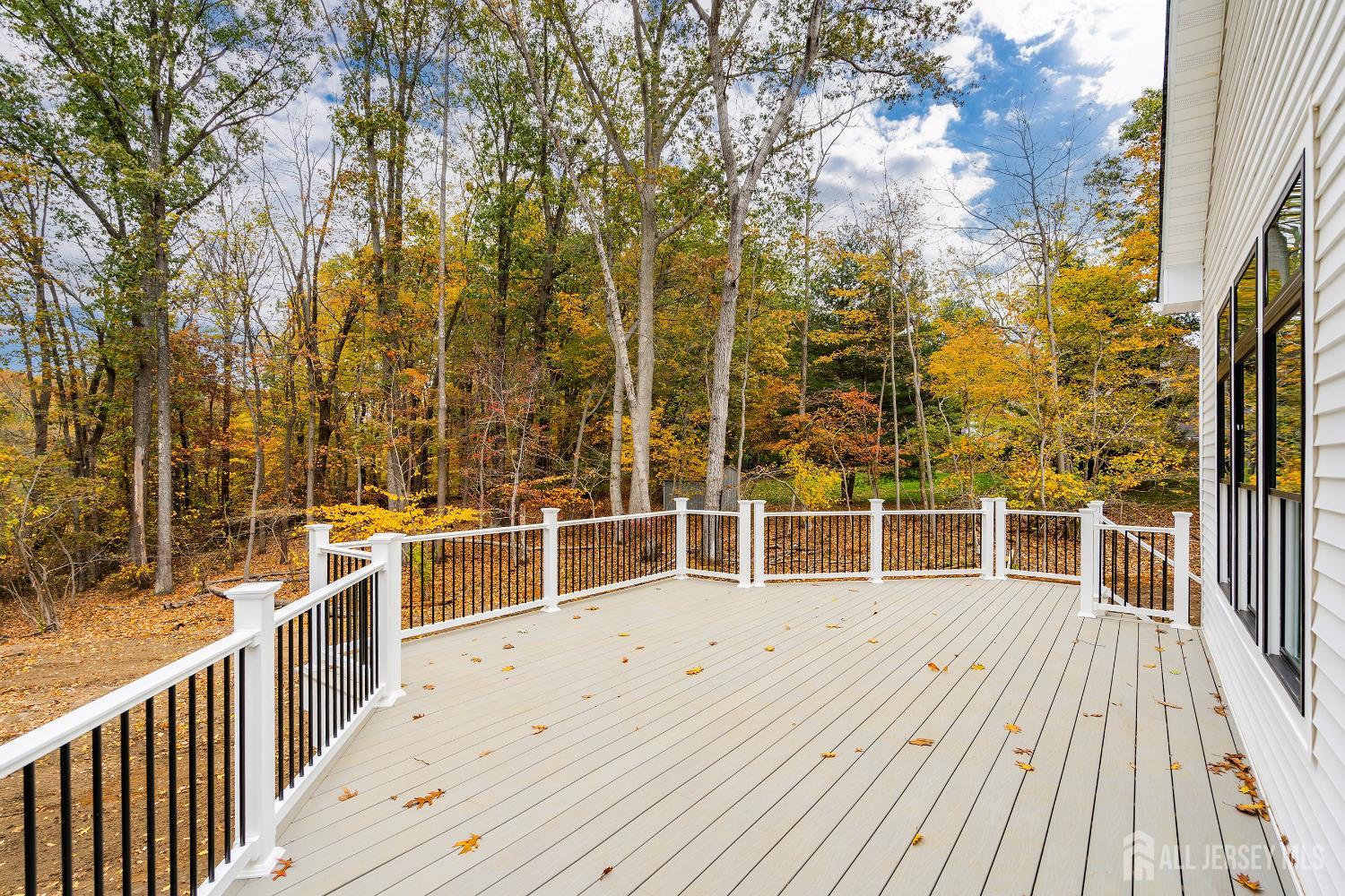 34 Mill Road Manalapan, NJ 07726 - Photo 18 of 30 a view of a balcony with wooden floor and fence