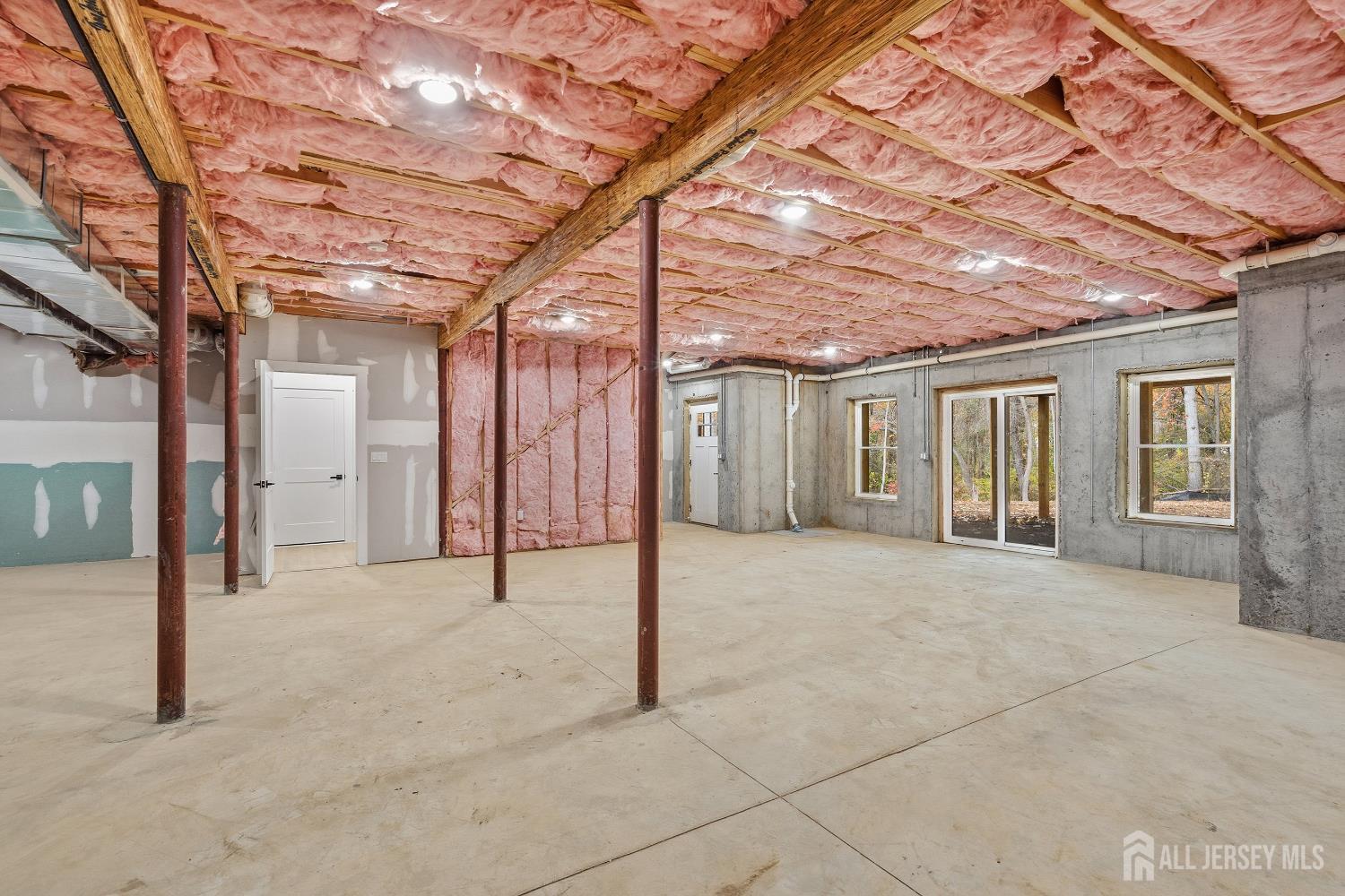 34 Mill Road Manalapan, NJ 07726 - Photo 20 of 30 a view of an empty room with a wrought fence