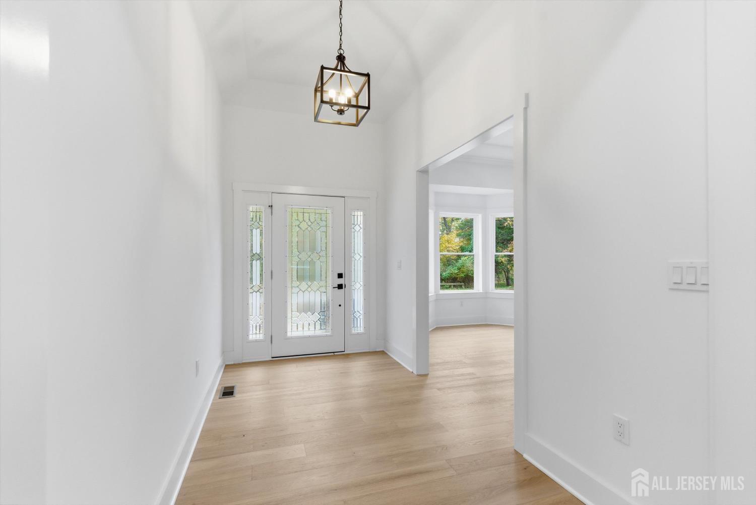 34 Mill Road Manalapan, NJ 07726 - Photo 2 of 30 a view of livingroom with hardwood floor and window