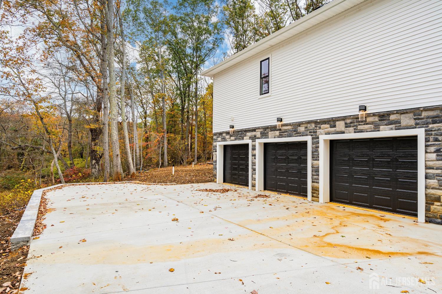 34 Mill Road Manalapan, NJ 07726 - Photo 22 of 30 a view of a house with wooden fence