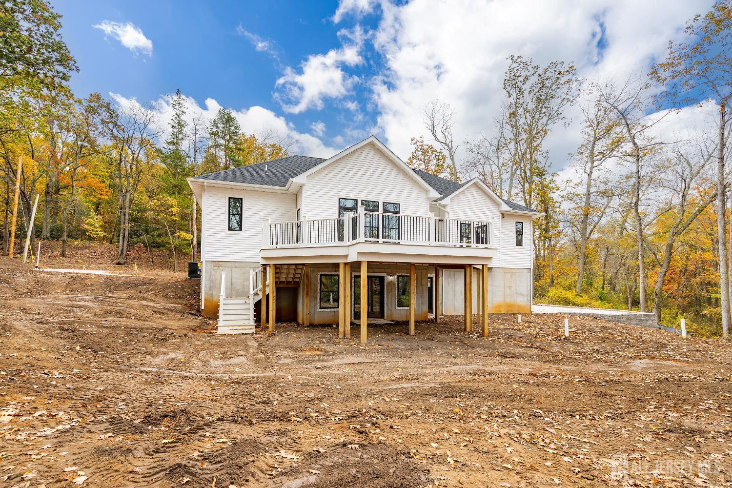 34 Mill Road Manalapan, NJ 07726 - Photo 24 of 30 a front view of a house with a garden