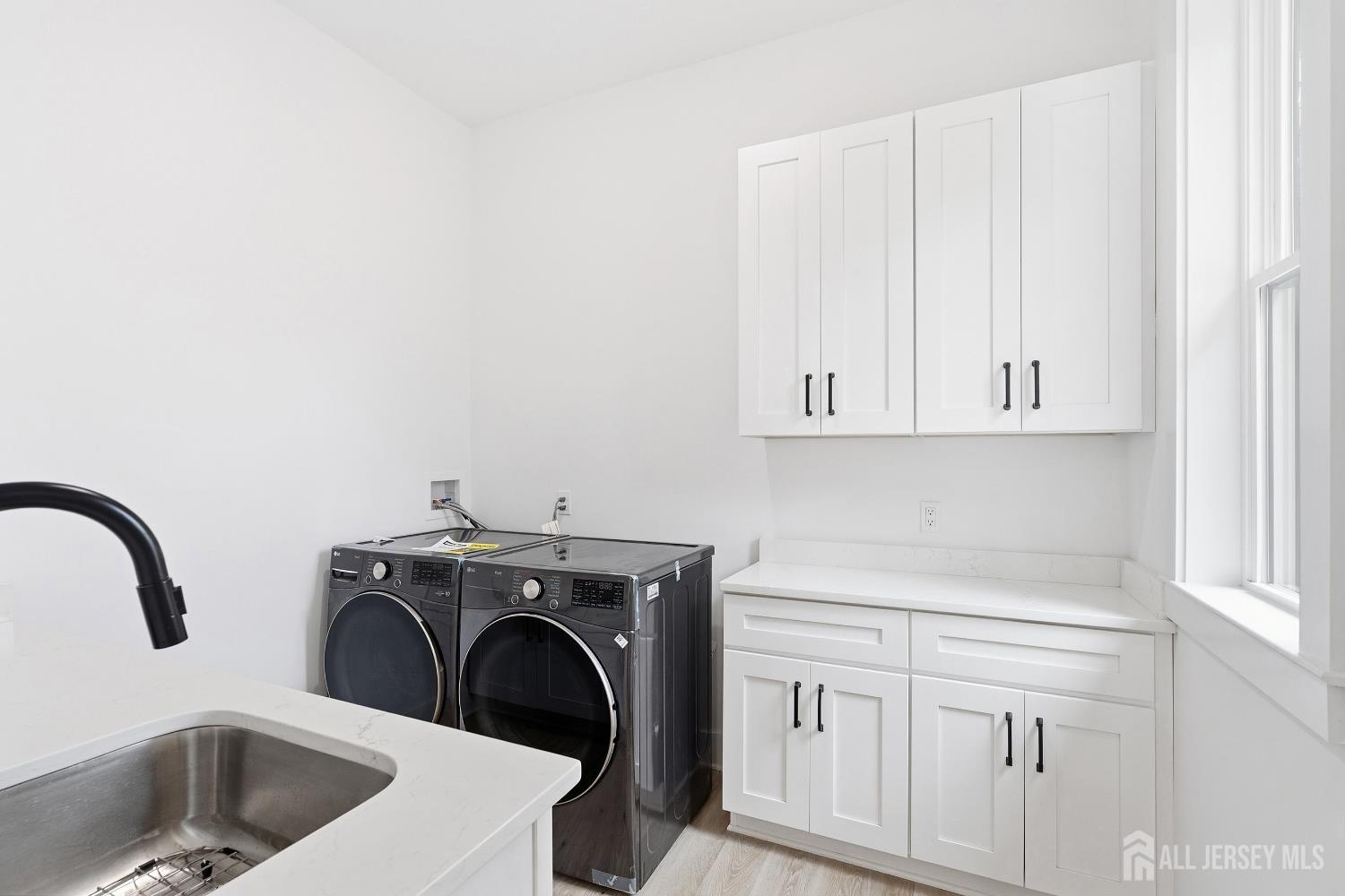 34 Mill Road Manalapan, NJ 07726 - Photo 9 of 30 a utility room with sink dryer and washer