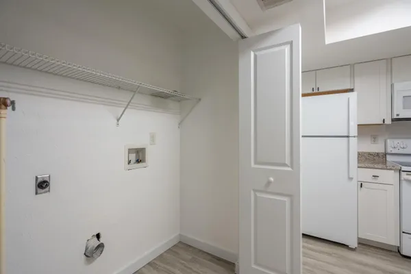 a view of a kitchen with a refrigerator