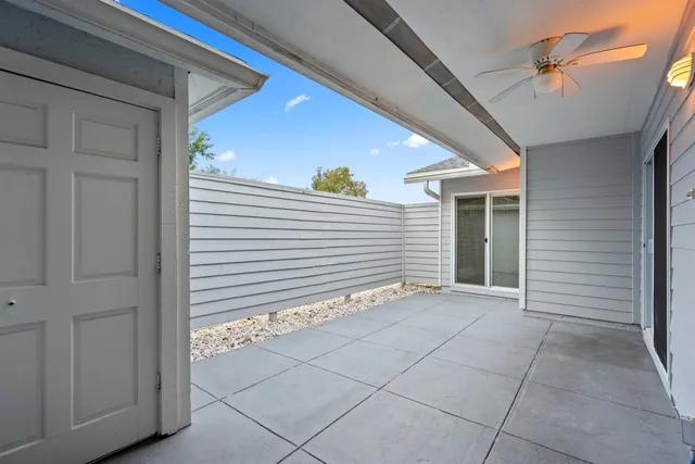 a view of an empty room with a windows