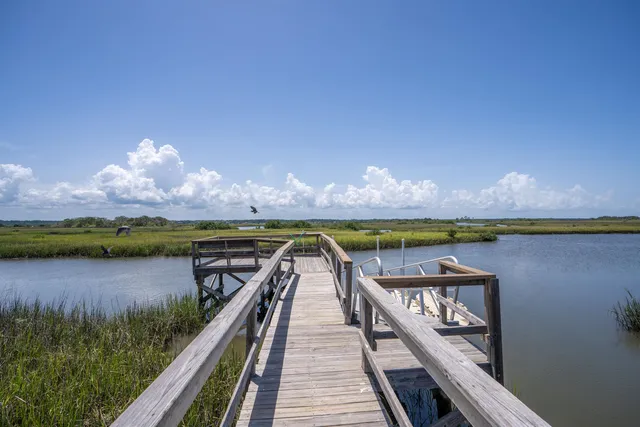 a view of a lake with a city from a balcony