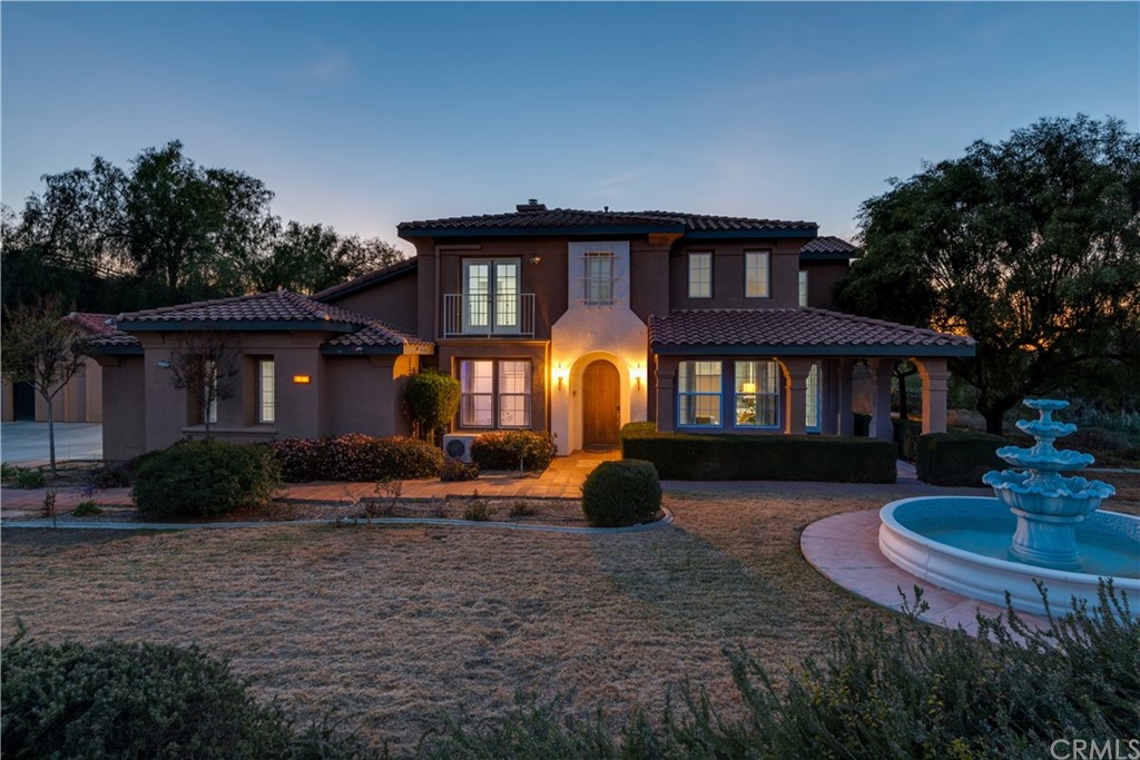 18779 Wildflower Way Riverside, CA 92504 - Photo 1 of 1 a front view of a house with garden and porch