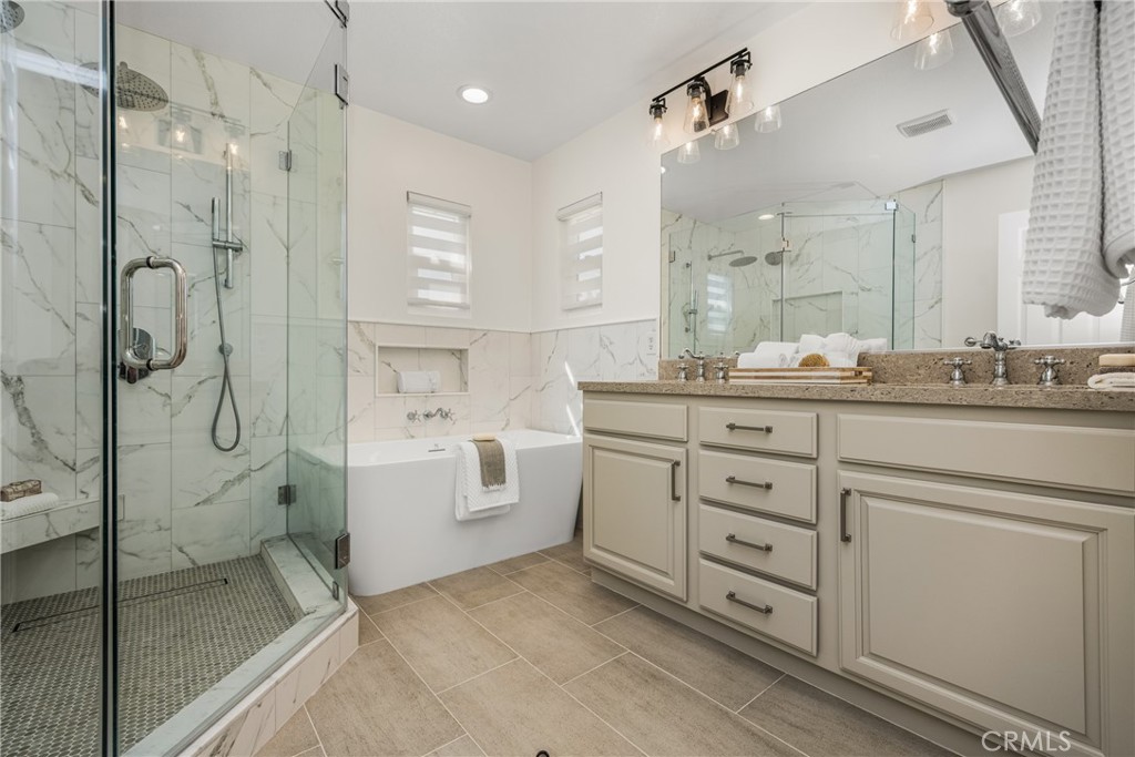 2981 Humeston Avenue Tustin, CA 92782 - Photo 16 of 52 Remodeled primary bathroom with soaking tub and large shower