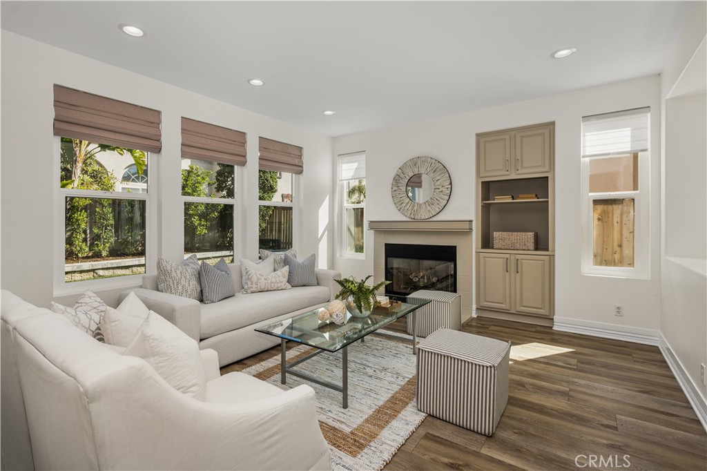 2981 Humeston Avenue Tustin, CA 92782 - Photo 8 of 52 Family room with fireplace and view of backyard