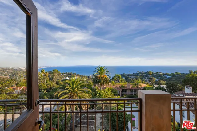 a room with a bed and a dresser