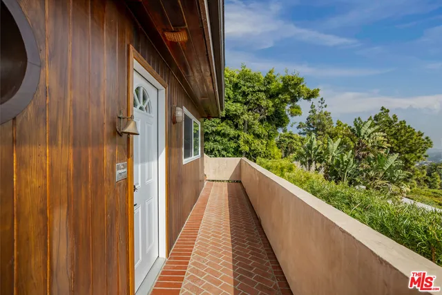 a living room with furniture a rug and a chandelier