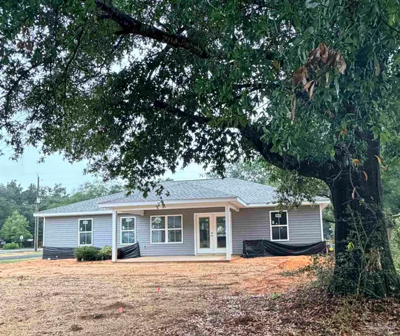 front view of a house with a yard