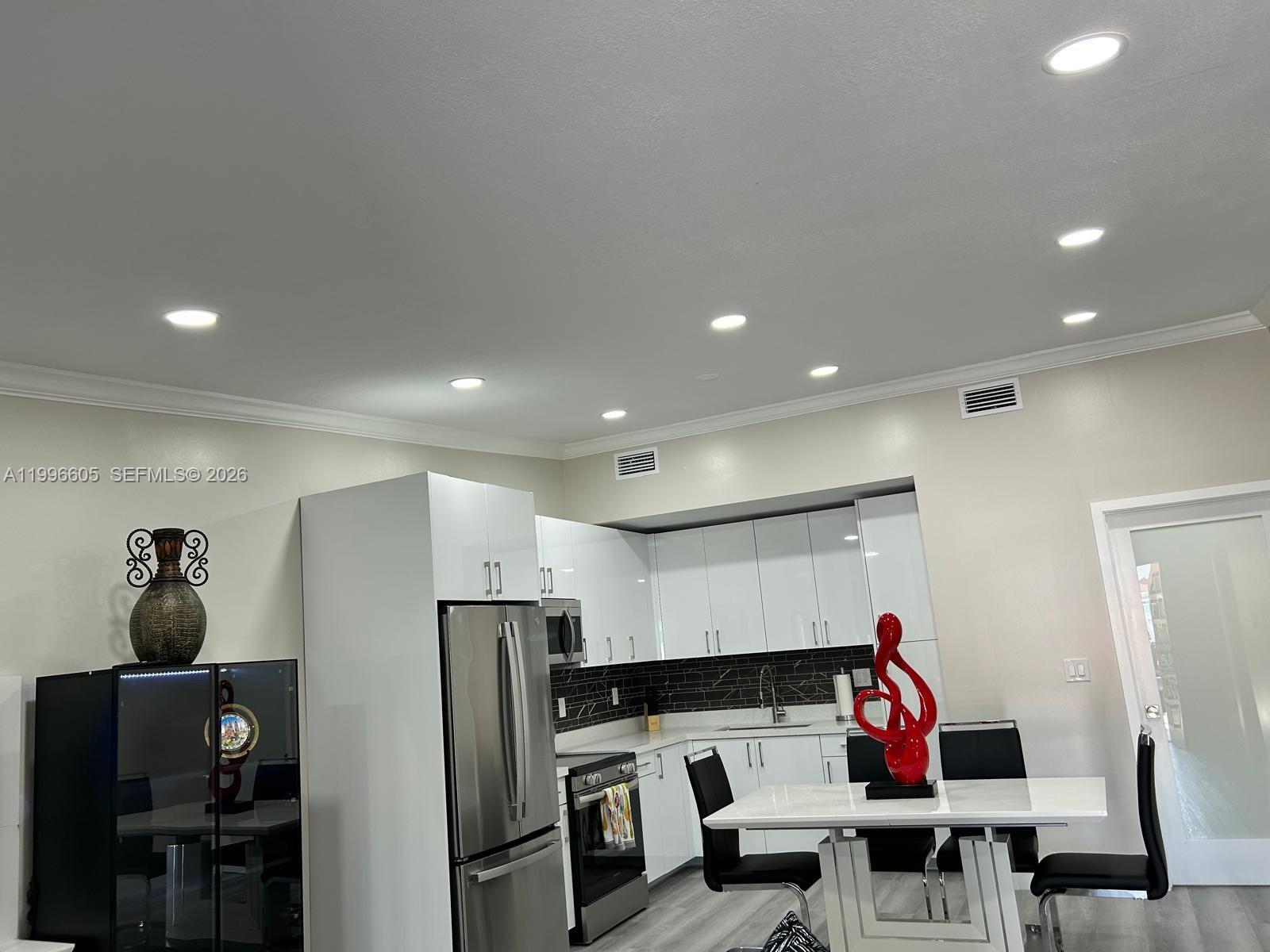 9922 Southwest 2nd Street, Unit A Miami, FL 33174 - Photo 11 of 24 a view of a room with shelves