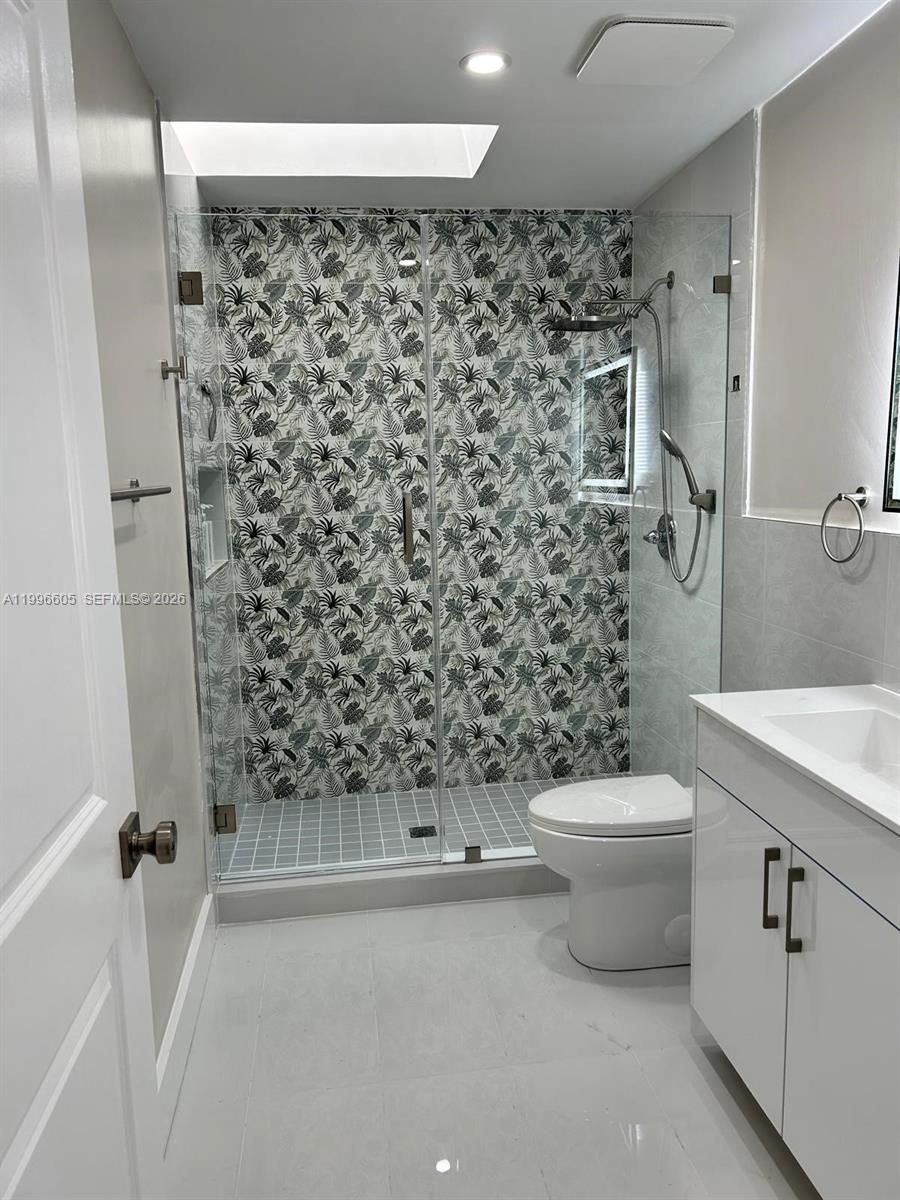 9922 Southwest 2nd Street, Unit A Miami, FL 33174 - Photo 19 of 24 a bathroom with a toilet and a shower