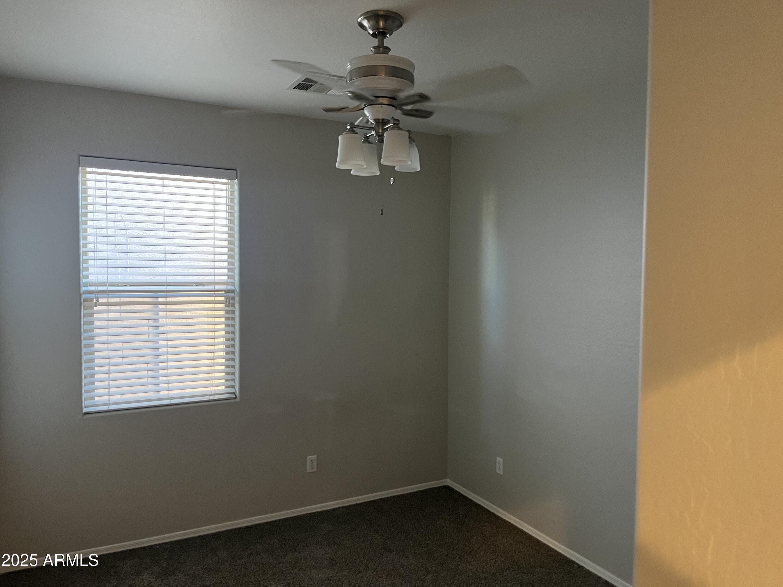 7007 West Carson Road Laveen, AZ 85339 - Photo 13 of 19 an empty room with a window