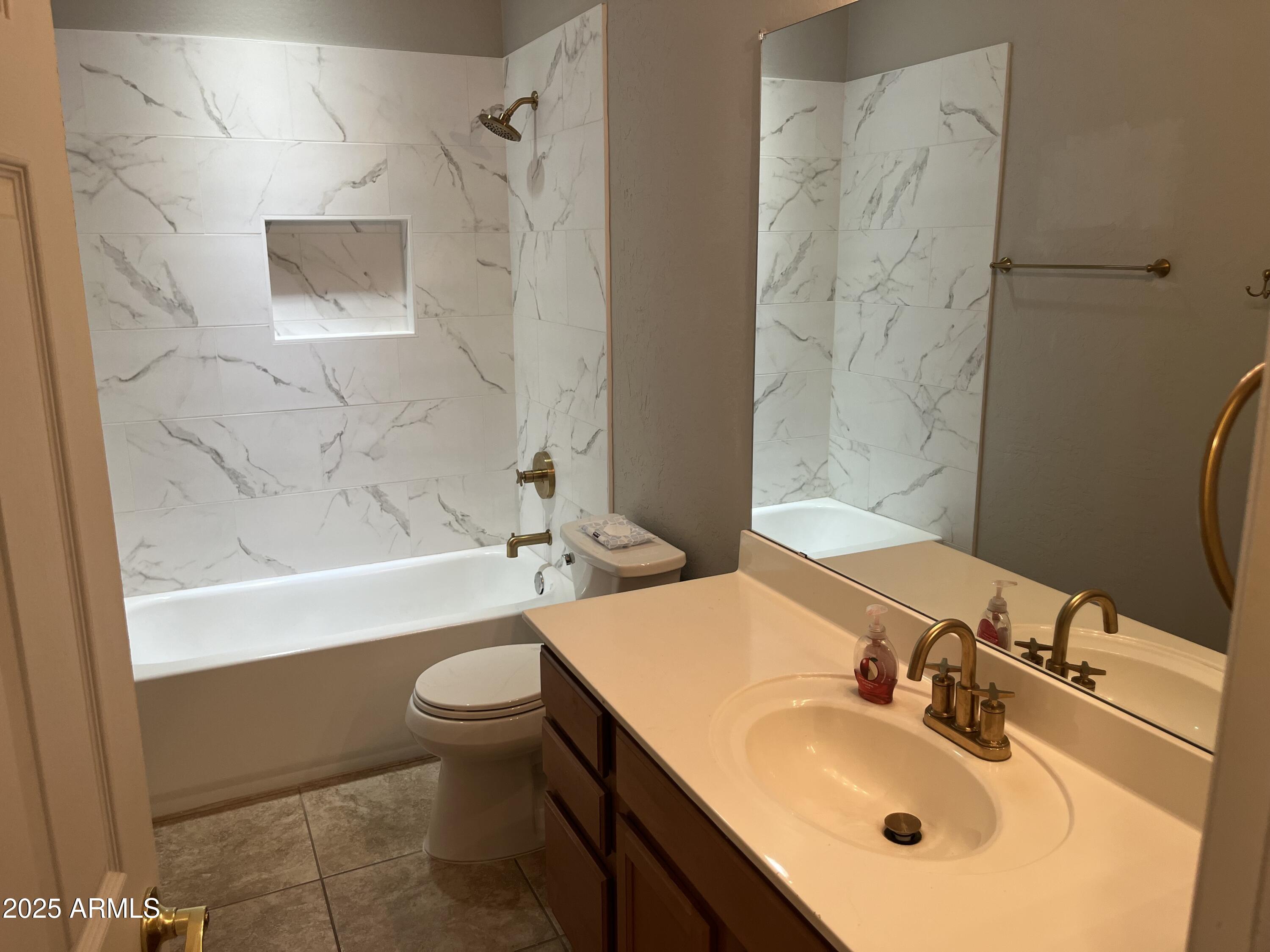 7007 West Carson Road Laveen, AZ 85339 - Photo 15 of 19 a bathroom with a sink toilet tub and shower