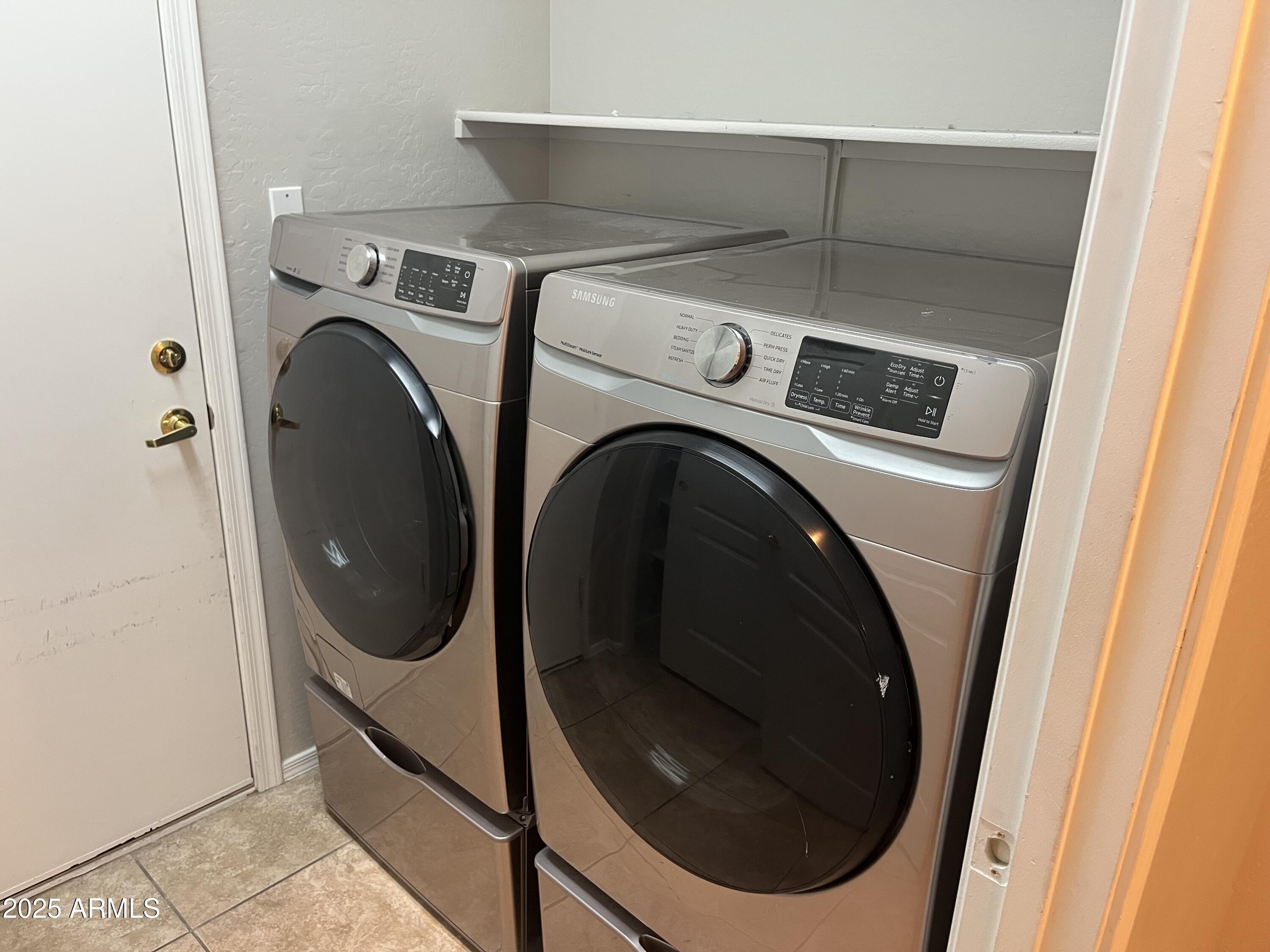7007 West Carson Road Laveen, AZ 85339 - Photo 17 of 19 a close up view of a washer and dryer