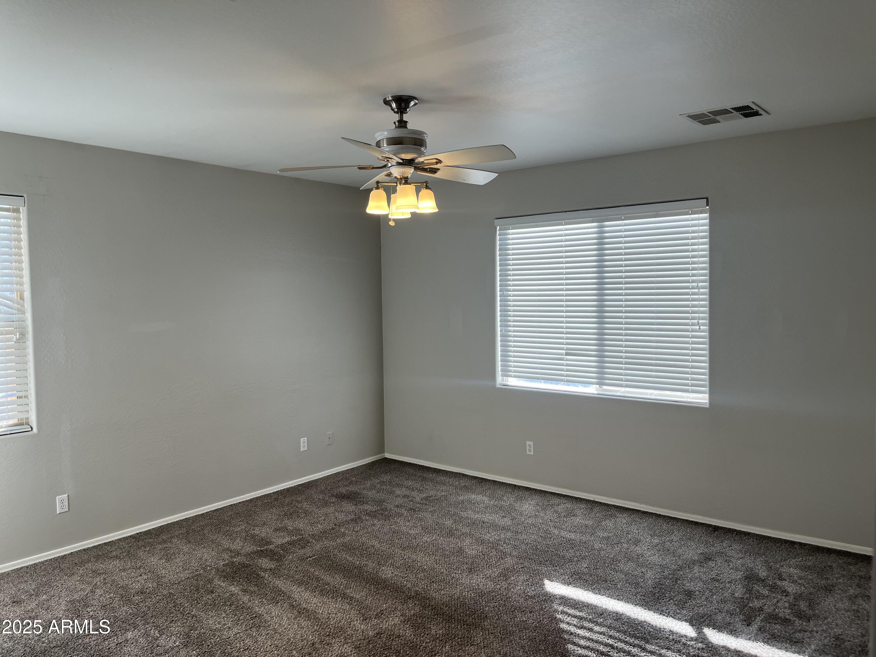 7007 West Carson Road Laveen, AZ 85339 - Photo 8 of 19 a view of an empty room with a window