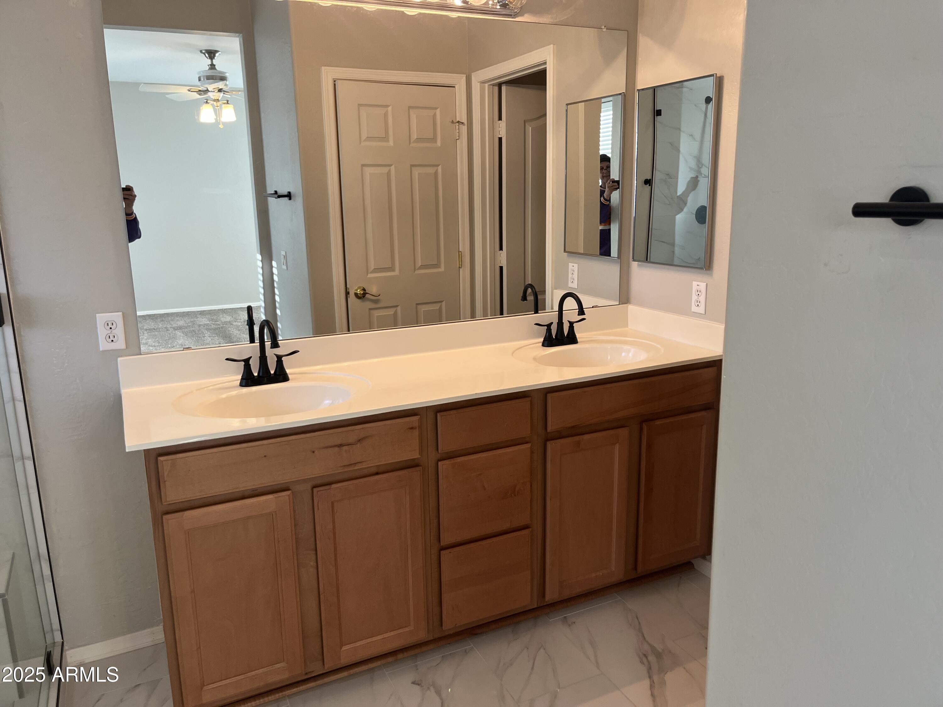 7007 West Carson Road Laveen, AZ 85339 - Photo 10 of 19 a bathroom with a sink and a mirror