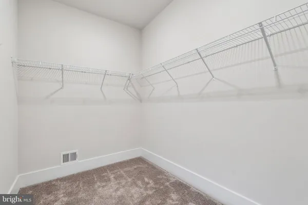 an empty room with wooden floor