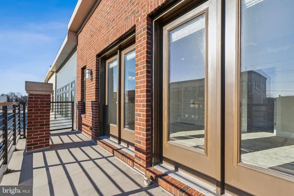 a view of a balcony with wooden floor