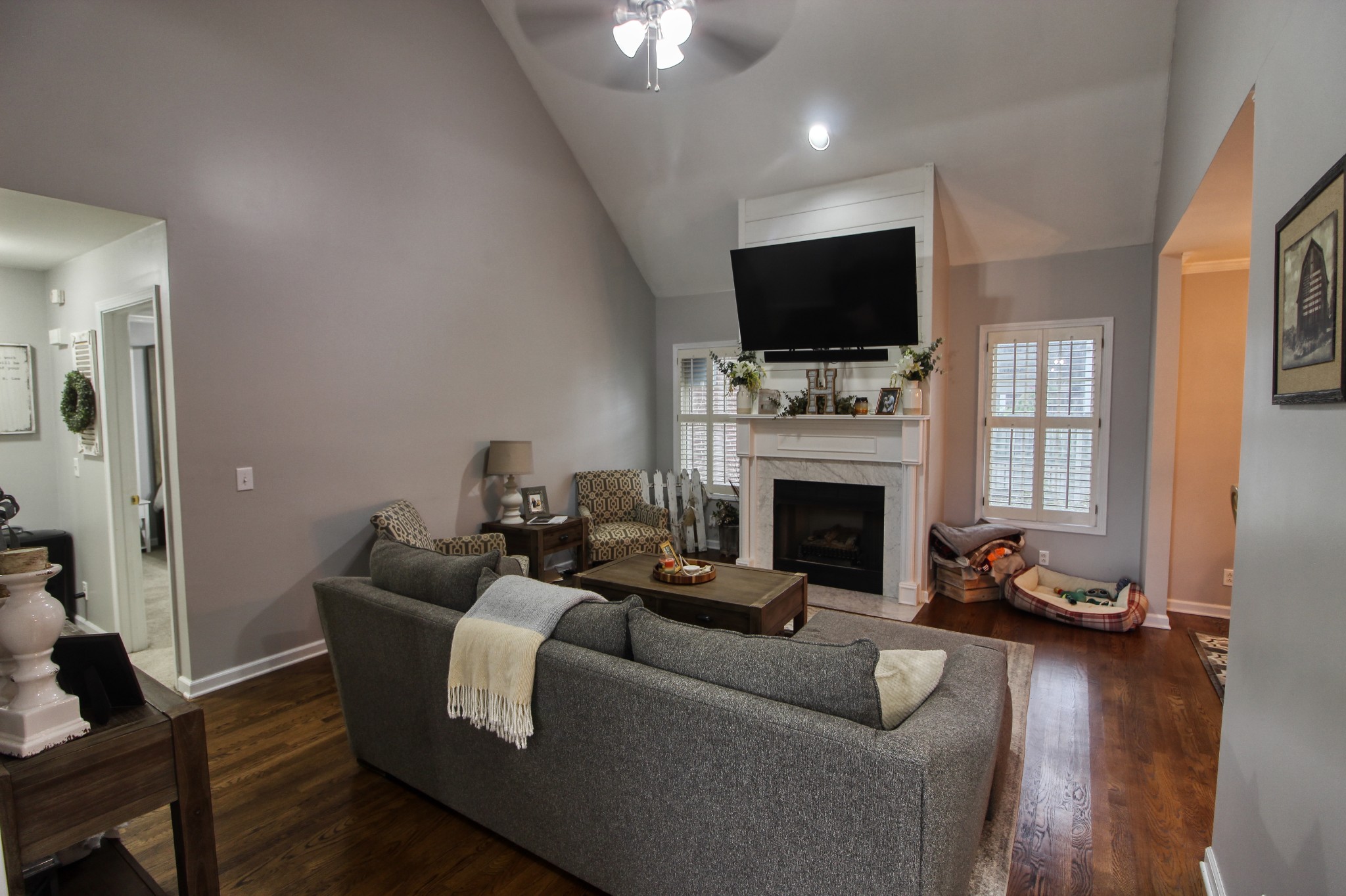124 Fieldstone Lane Springfield, TN 37172 - Photo 3 of 21 a living room with furniture a flat screen tv and a fireplace