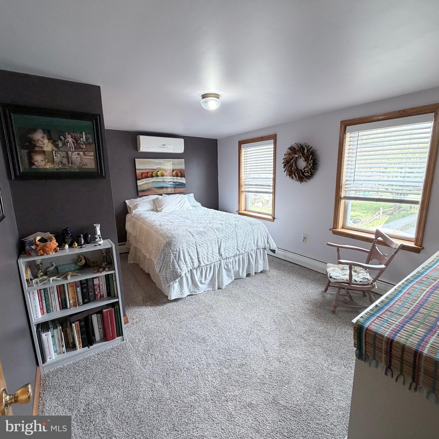 12997 Main Street Fort Loudon, PA 17224 - Photo 35 of 48 a bedroom with a bed a bookshelf and a window