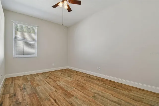 a view of a kitchen with microwave and cabinets