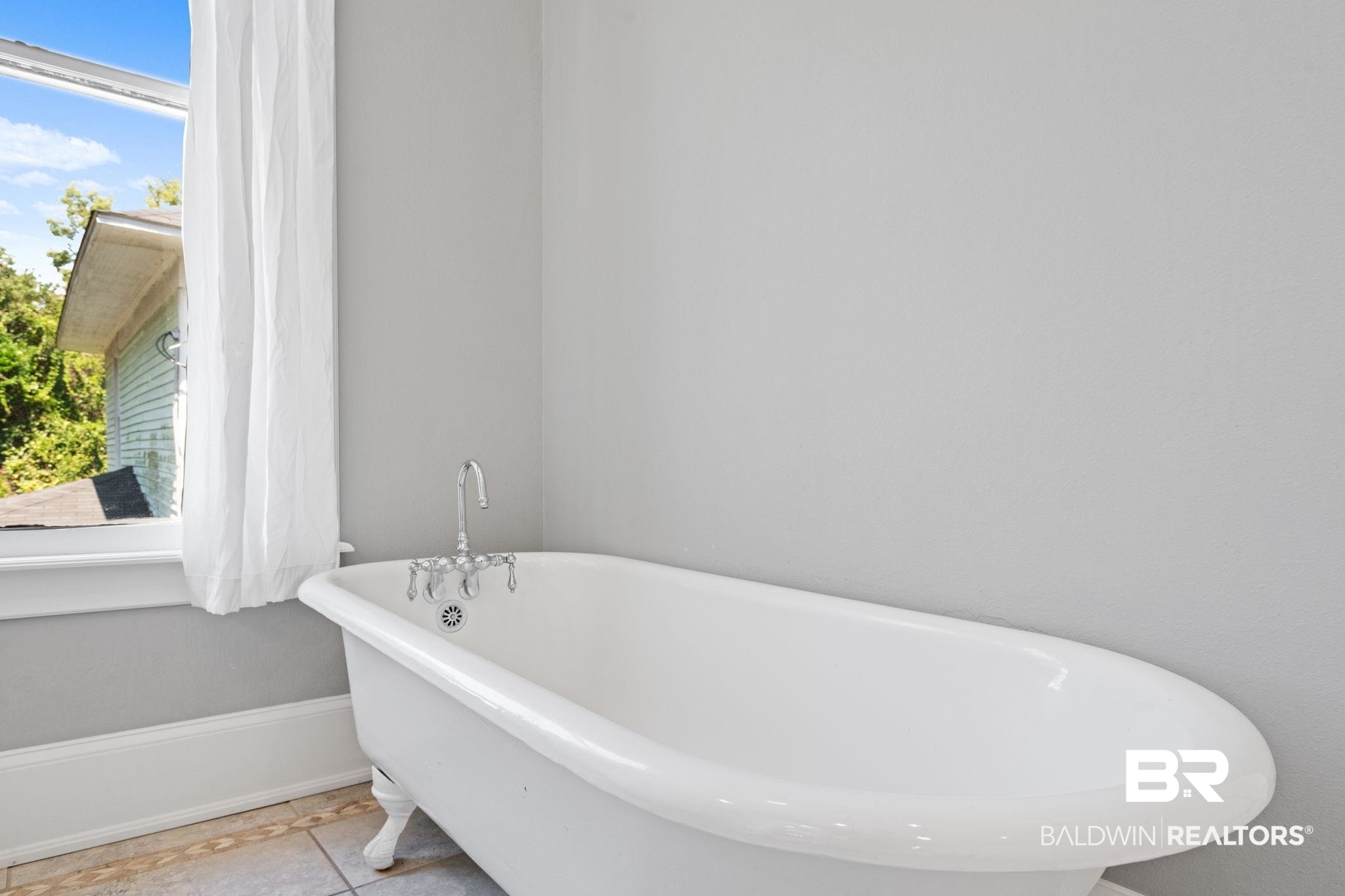 10 South Monterey Street Mobile, AL 36604 - Photo 25 of 45 Full bathroom featuring a freestanding tub and tile patterned floors