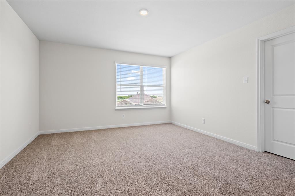 521-a D A D Crain Street Venus, TX 76084 - Photo 11 of 17 an empty room with windows