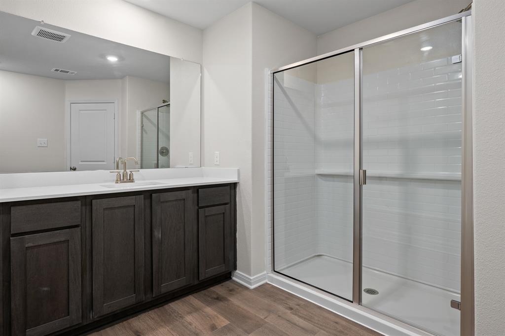 521-a D A D Crain Street Venus, TX 76084 - Photo 13 of 17 a bathroom with a double vanity sink and shower