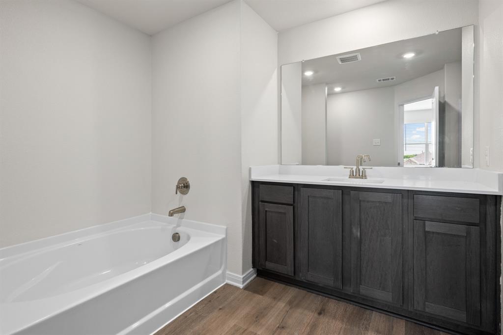 521-a D A D Crain Street Venus, TX 76084 - Photo 14 of 17 a bathroom with a bathtub and a sink