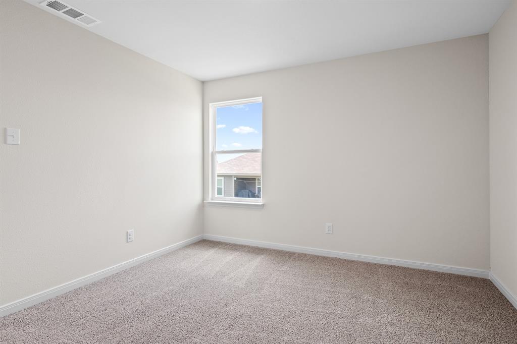 521-a D A D Crain Street Venus, TX 76084 - Photo 16 of 17 a view of an empty room with a window