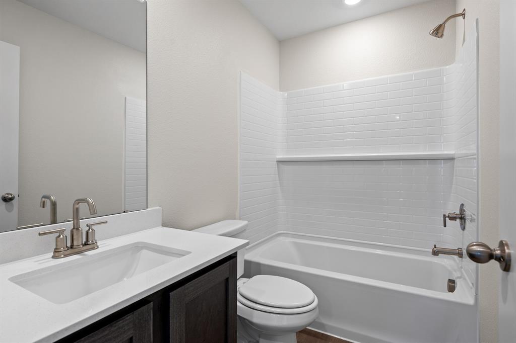 521-a D A D Crain Street Venus, TX 76084 - Photo 17 of 17 a bathroom with a sink a toilet and bathtub
