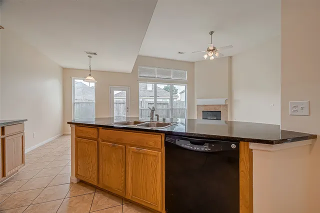 a view of an empty room with windows