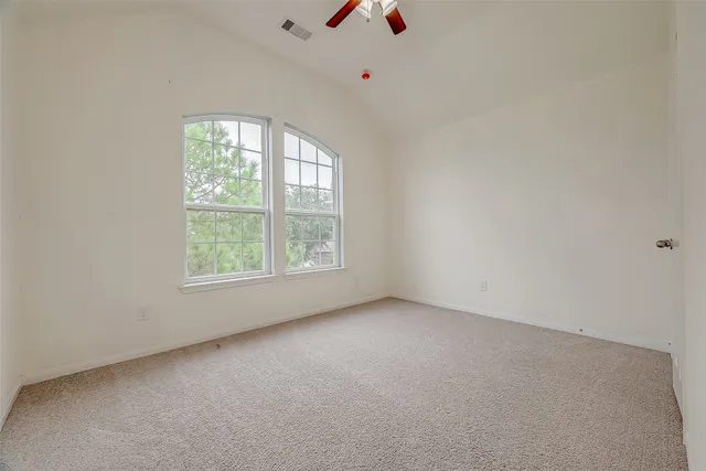 a view of an empty room and entryway