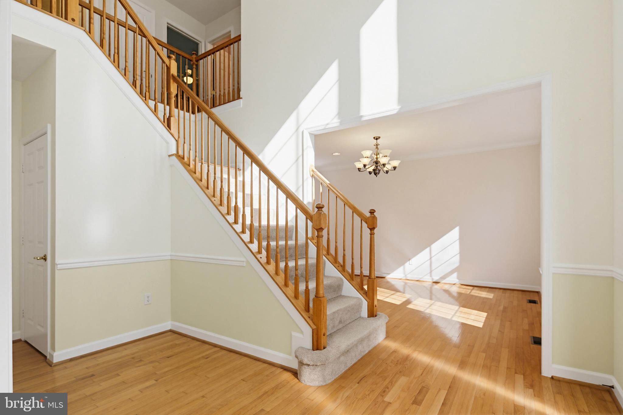 12017 Floating Clouds Path Clarksville, MD 21029 - Photo 21 of 54 a view of entryway and hall with wooden floor