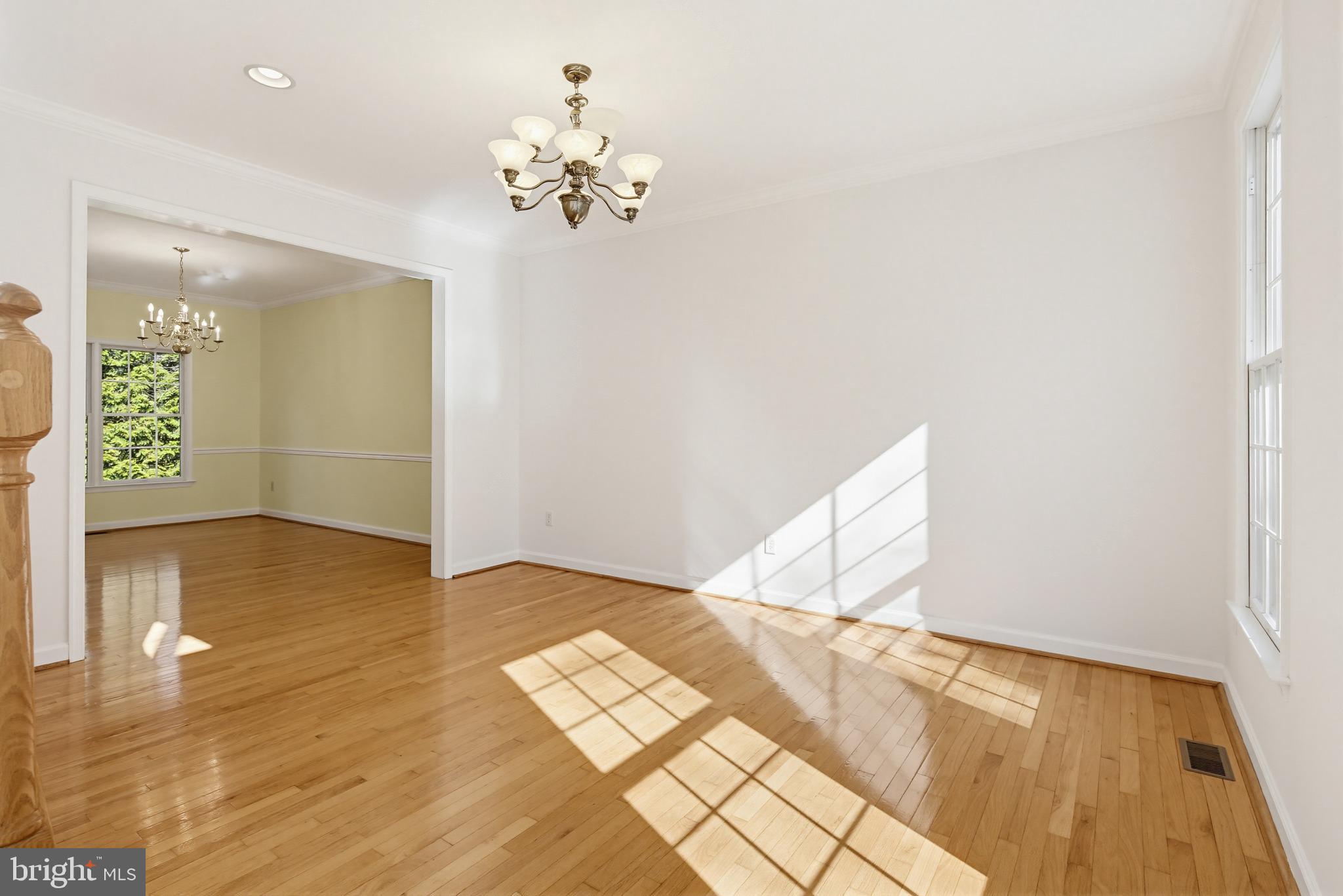 12017 Floating Clouds Path Clarksville, MD 21029 - Photo 23 of 54 a view of an empty room with wooden floor